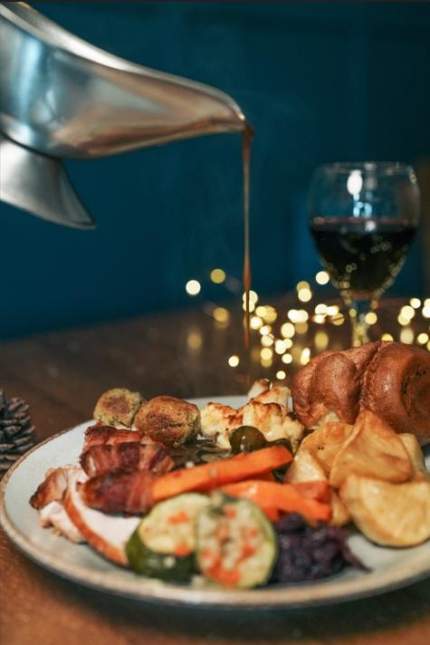 Festive carvery with gravy being poured